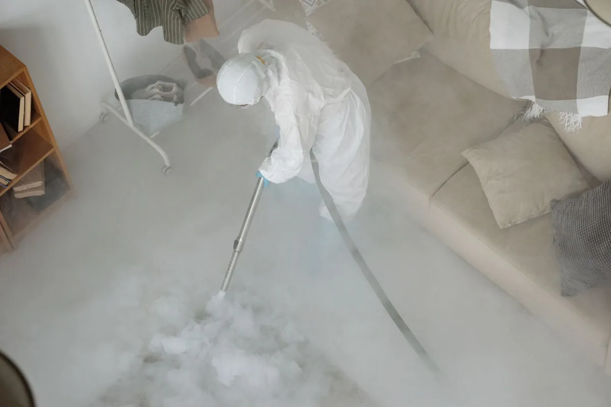 Biohazard cleanup technician in protective equipment, West End, NY